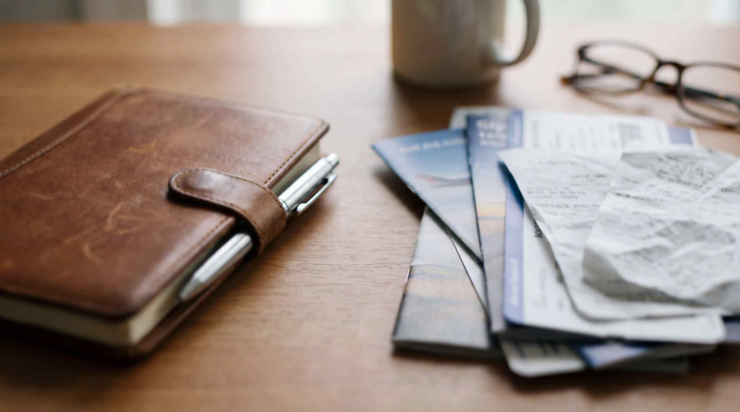 A wallet, pen and airfare tickets.
